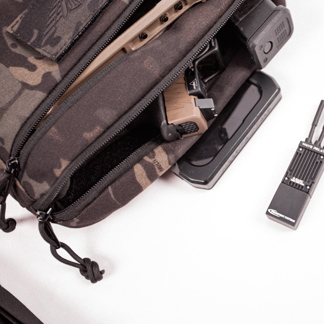Camouflage pouch with tools on a white background