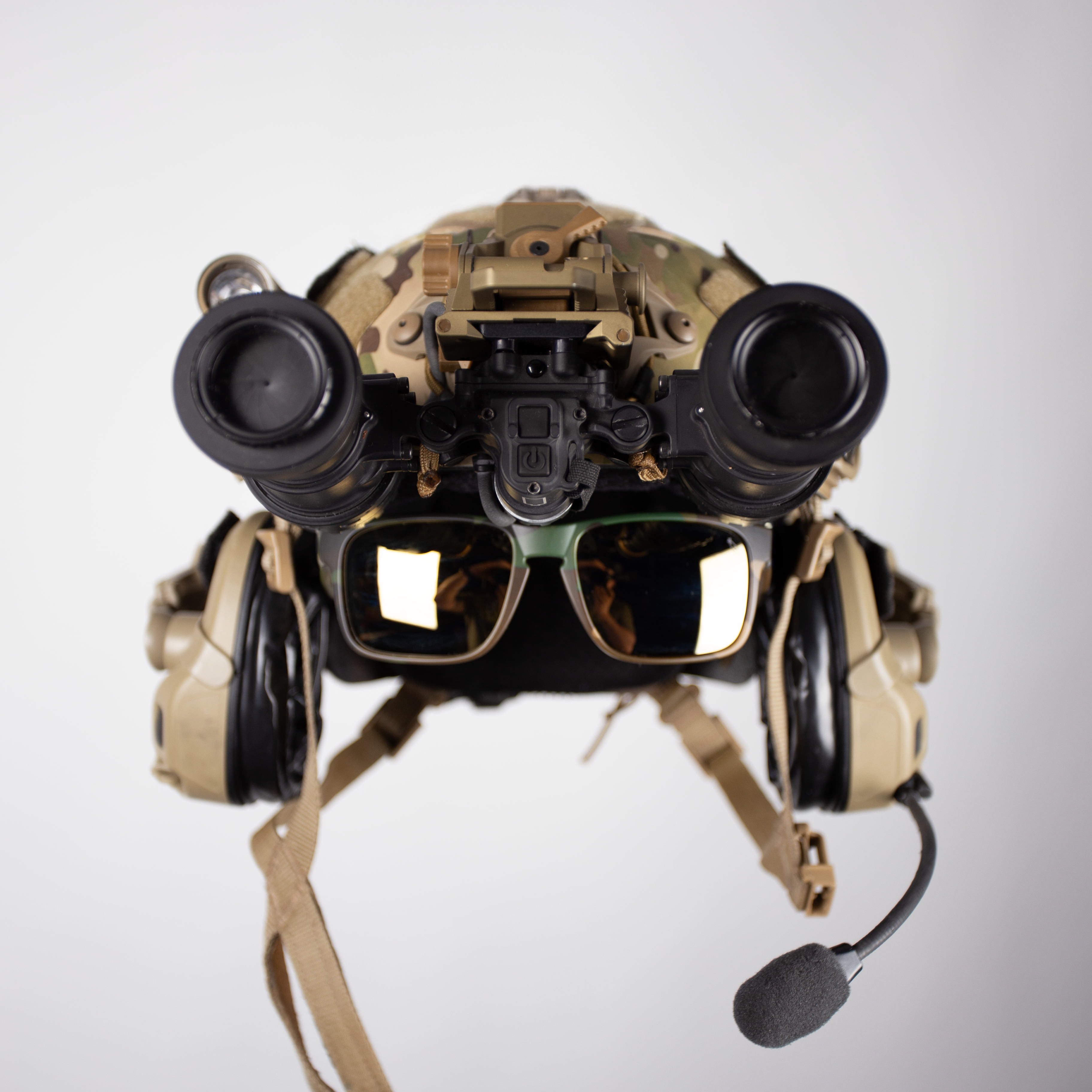 Tactical helmet with NIGHT VISION, sunglasses, and microphone on a white background