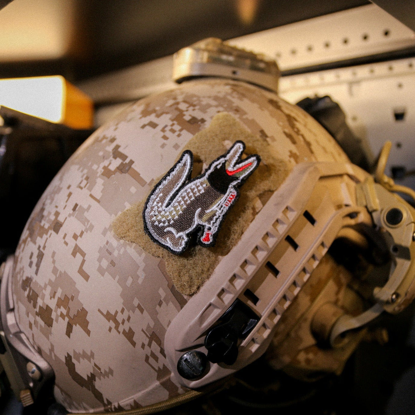 Camouflage helmet with a patch on a military vehicle interior