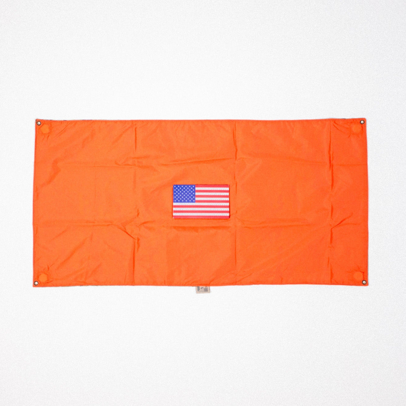 Orange flag with a small American flag patch on a white background