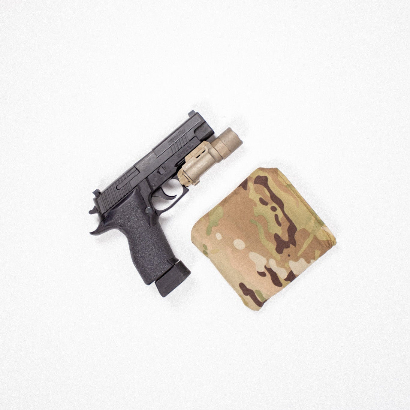 Pistol with a multi-colored magazine on a white background